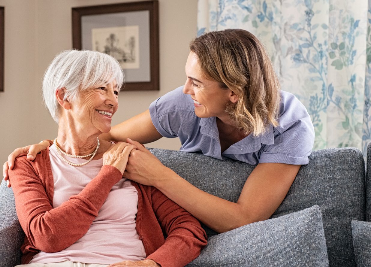 Nurse and smiling senior woman.