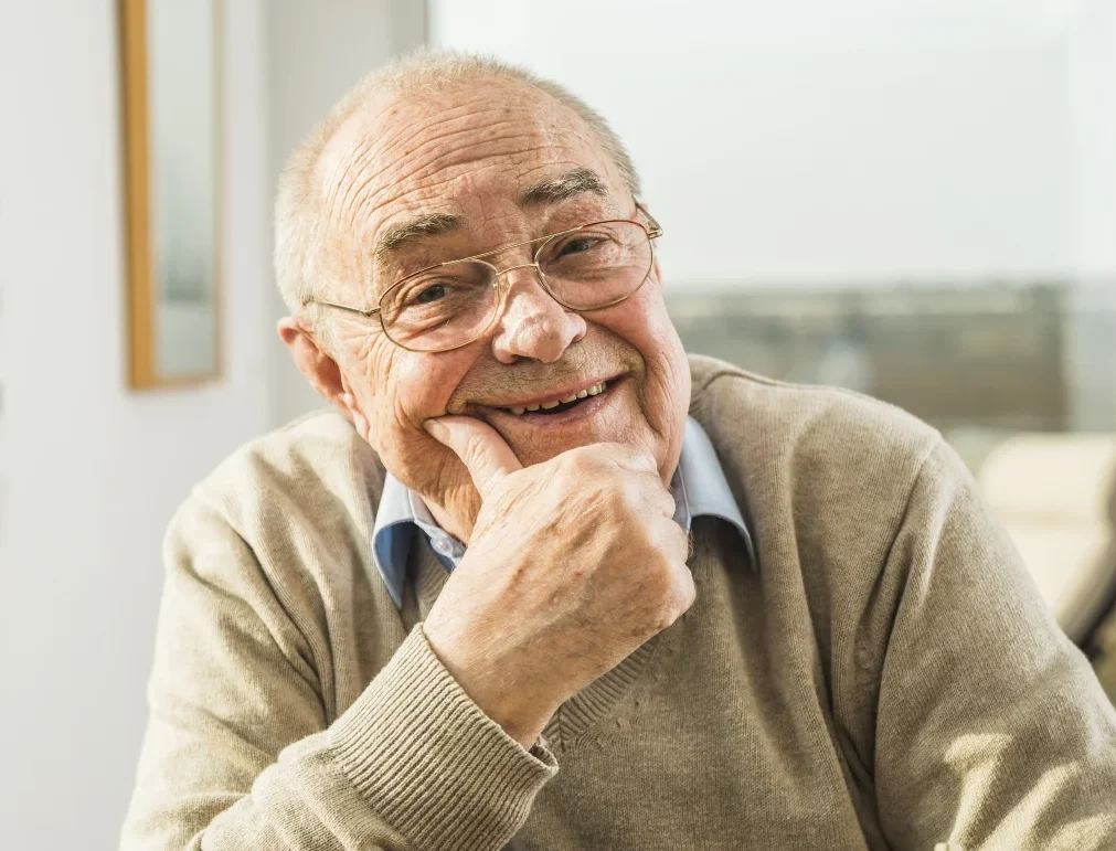 senior man smiling with glasses