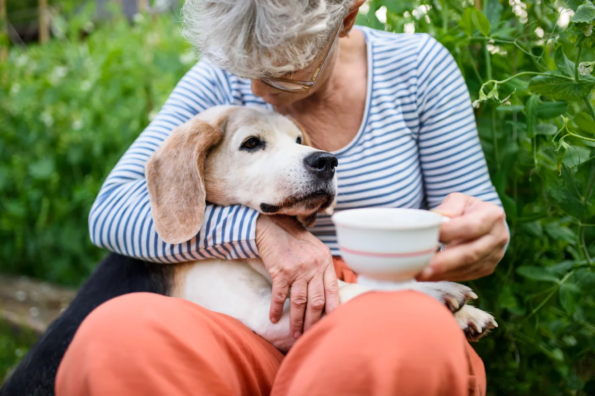 woman with dog in pet friendly senior living community