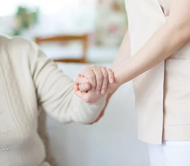 senior lady being helped up by nurse